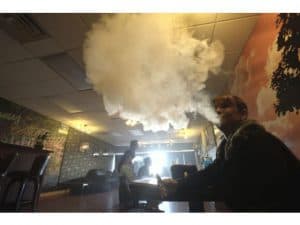 Lady Using Vaporizer Lady Using Vaporizer